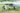 Skyeye Carbon fiber 6000mm UAV Fixed Wing Drone on grass field showing detail of disc brake system.